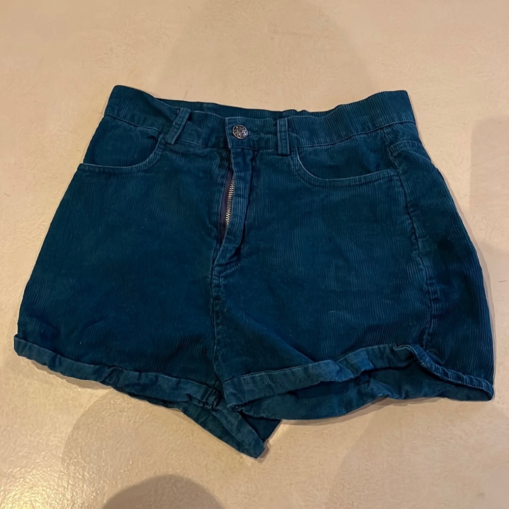 From Shekou. Dark green jean shorts.